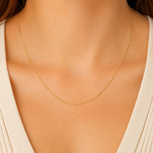 Woman wearing a delicate 14K Gold Trace Chain Necklace by Lucche