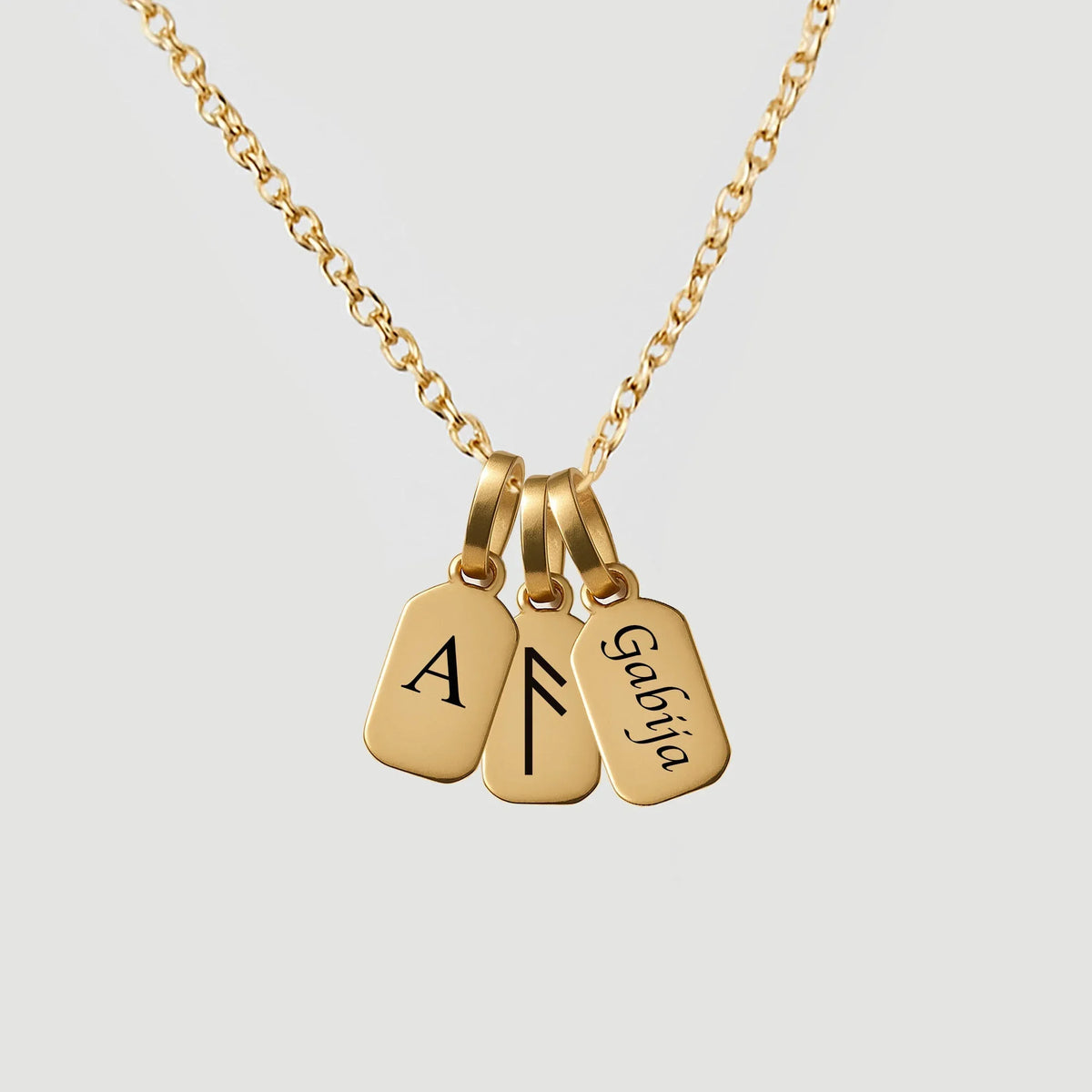 Gold chain necklace with three personalized engraved gold dog tag pendants