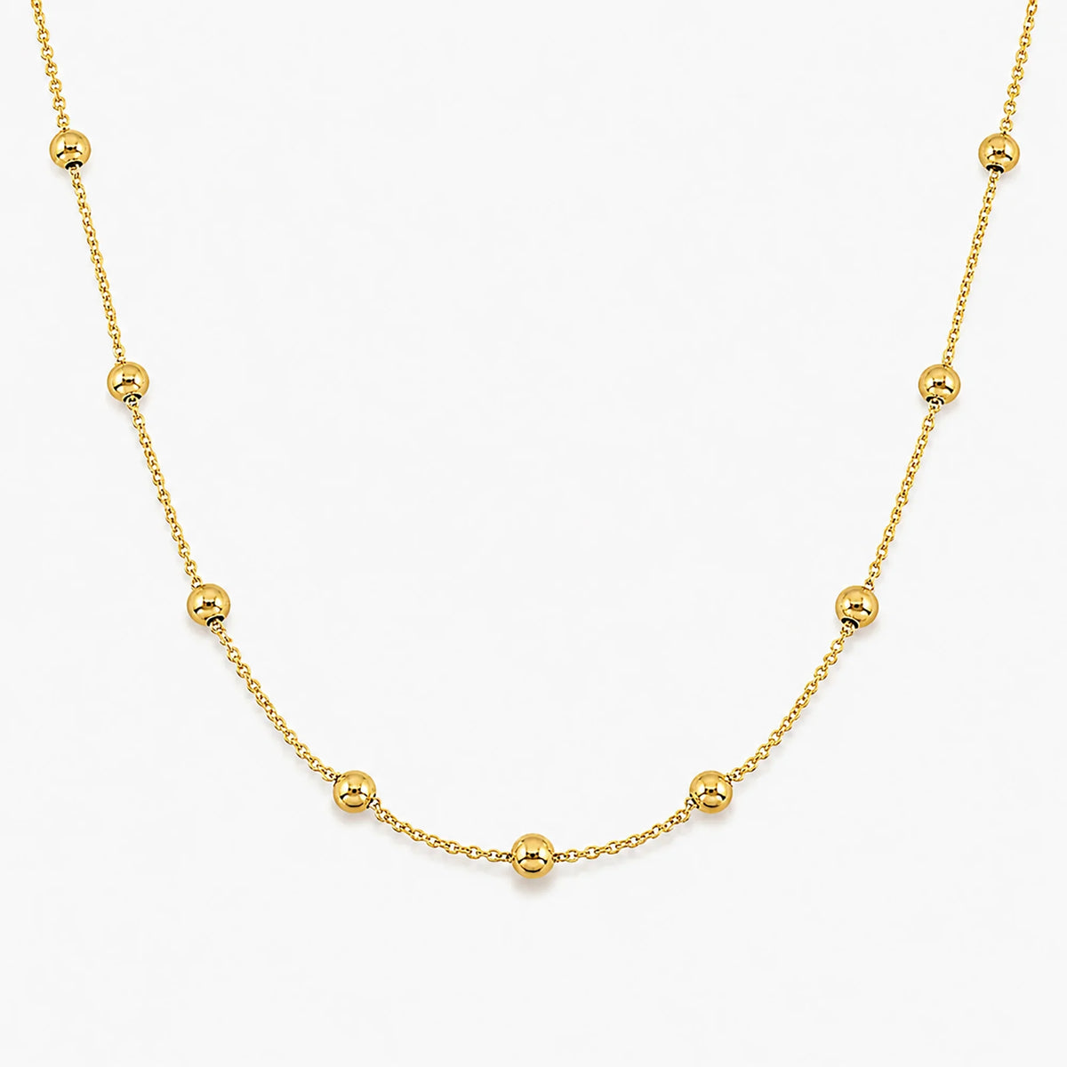 Lucche 14K gold beaded necklace with polished gold spheres on a delicate chain