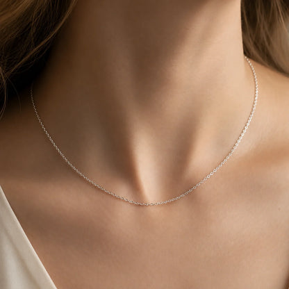 Woman wearing a Lucche 14K solid white gold fine chain necklace.