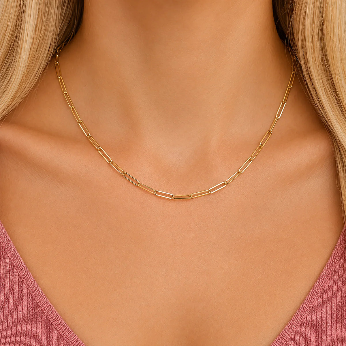 Woman wearing a Lucche 14K gold paperclip chain necklace