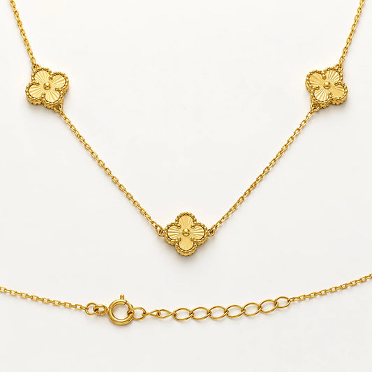 14K solid gold clover station necklace by Lucche with three embossed four-leaf clover charms